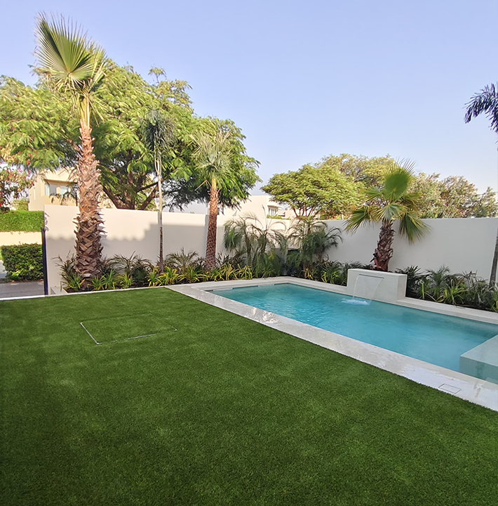 Artificial Grass Dubai Installation With Swimming Pool